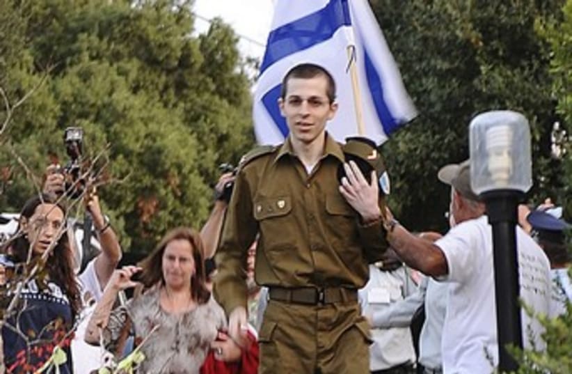 Gilad Schalit arrives from captivity 370 (photo credit: REUTERS/Handout )