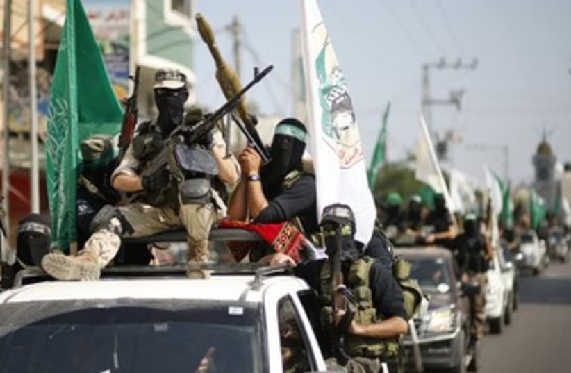 Hamas terrorists mark anniversary of Schalit swap 370 (photo credit: REUTERS/Mohammed Salem)