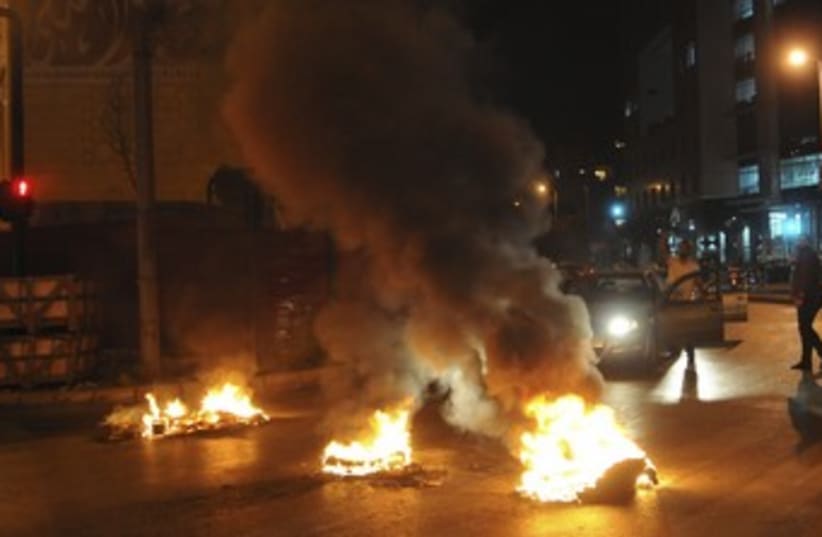 Sunni Muslims burn tires in Lebanon 370 (photo credit: REUTERS/Stringer)