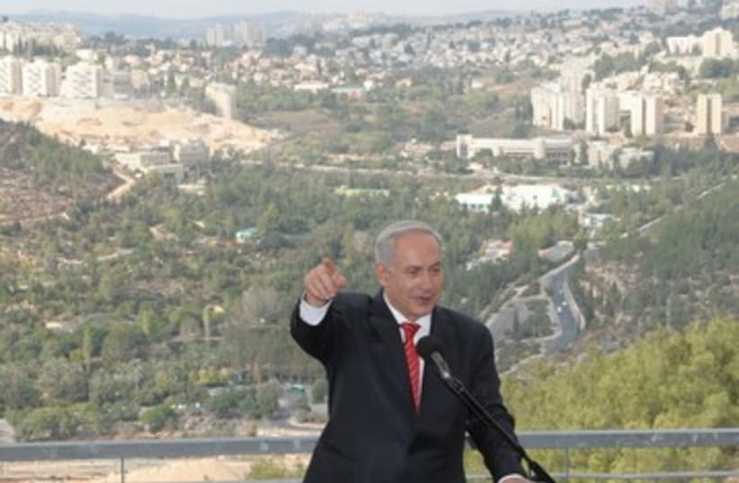Netanyahu speaking against Gilo backdrop 390 (photo credit: Moshe Milner / GPO)