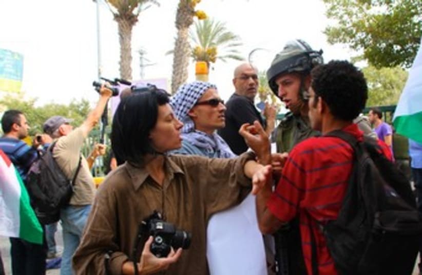 Activists protst outside Binyamin Rami Levy 370 (photo credit: TOVAH LAZAROFF)