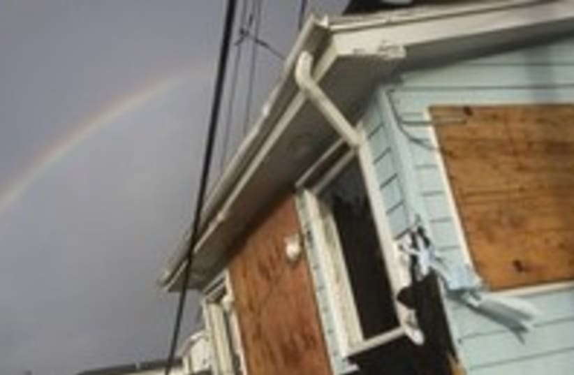A rainbow is seen among homes devasted by Sandy 300 (photo credit: REUTERS/ Adam Hunger )