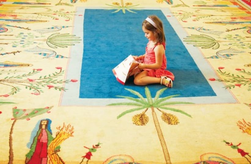 Child sits on carpet [illustrative] 521 (photo credit: Ma’ayan Ben-Artzi)