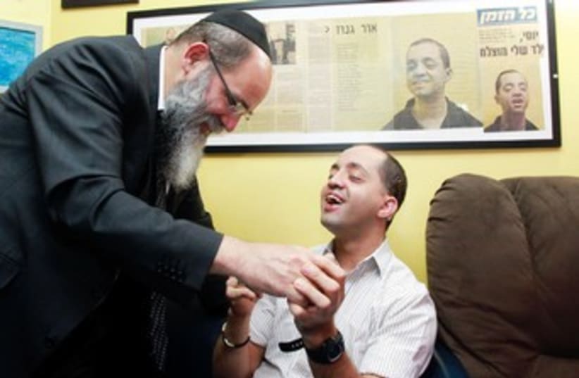 Rabbi Kalman Samuels and son 370 (photo credit: Marc Israel Sellem/The Jerusalem Post)