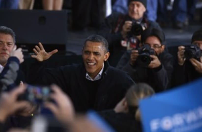Obama greets supporters during a campaign rally in Dubuque 3 (photo credit: REUTERS)