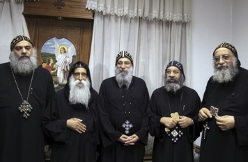 New Coptic Pope Tawdros (R) with candidates 390 (photo credit: Mohamed Abd El Ghany / Reuters)