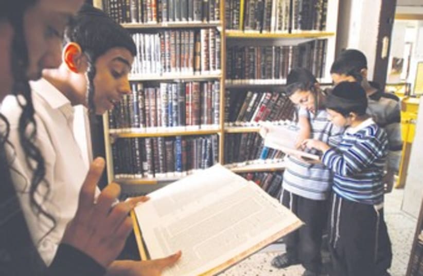 BOYS STUDY Talmud at their school’s synagogue in Bnei Brak 3 (photo credit: REUTERS/Gil Cohen Magen)
