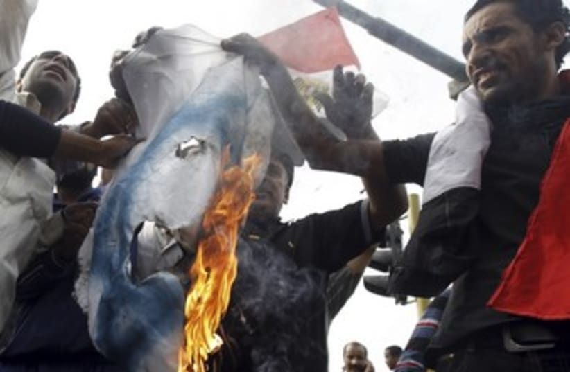Protesters burn Israeli flag in Cairo 370 (photo credit: REUTERS/Mohamed Abd El Ghany)