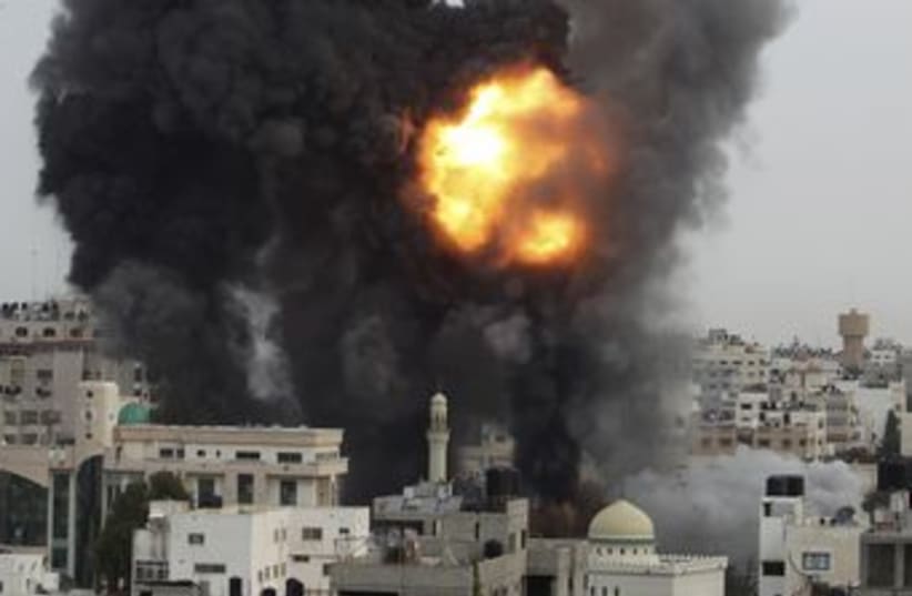 An Israeli air strike in the Gaza Strip 370 (R) (photo credit: Suhaib Salem / Reuters)