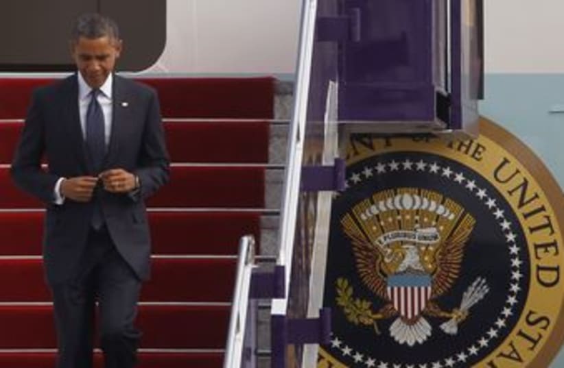 US President Barack Obama deplanes Air Force One 310 (R) (photo credit: Chaiwat Subprasom / Reuters)