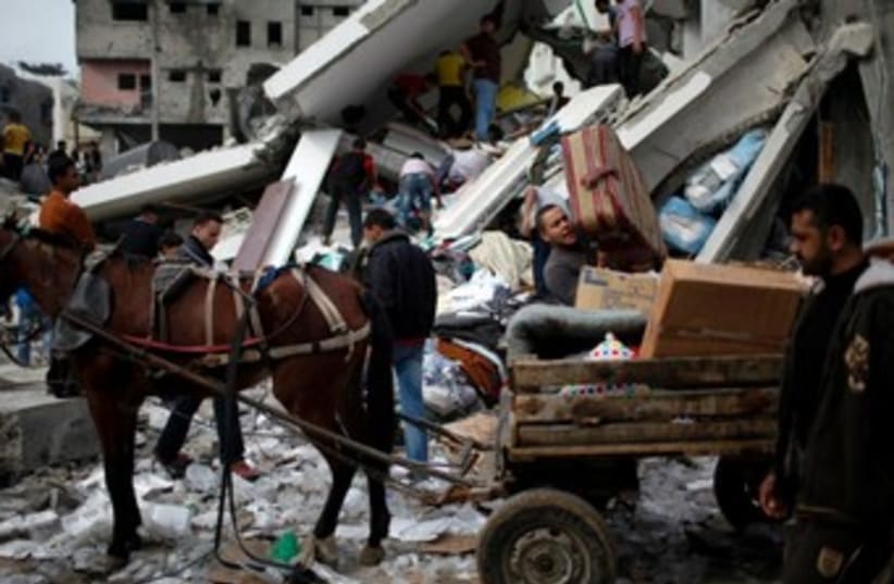 Horse drawn buggy in Gaza amid wreckage and destruction 370 (photo credit: Reuters/Ahmed Jadallah)
