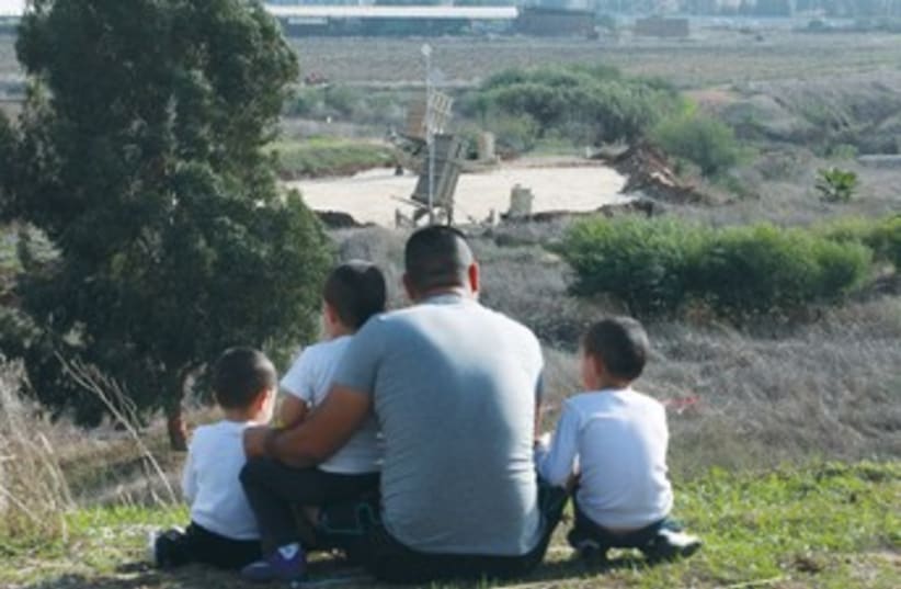 Onlookers at Gush Dan Iron Dome battery 370 (photo credit: Marc Israel Sellem/The Jerusalem Post)
