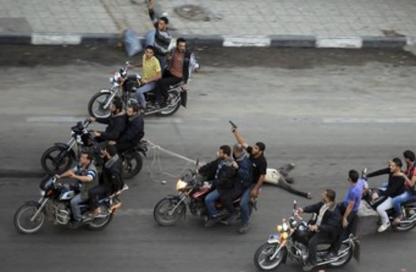 Palestinian gunmen motorbikes GRAPHIC 370 (photo credit: REUTERS/Suhaib Salem)