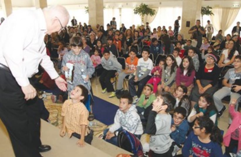 Rivlin and children of South 390 (photo credit: Courtesy Knesset)