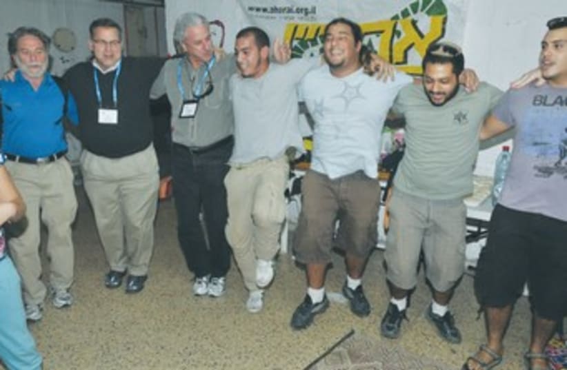 JFNA's Silverman, Siegal with volunteers in Ashkelon 370 (photo credit: Courtesy JNFA)