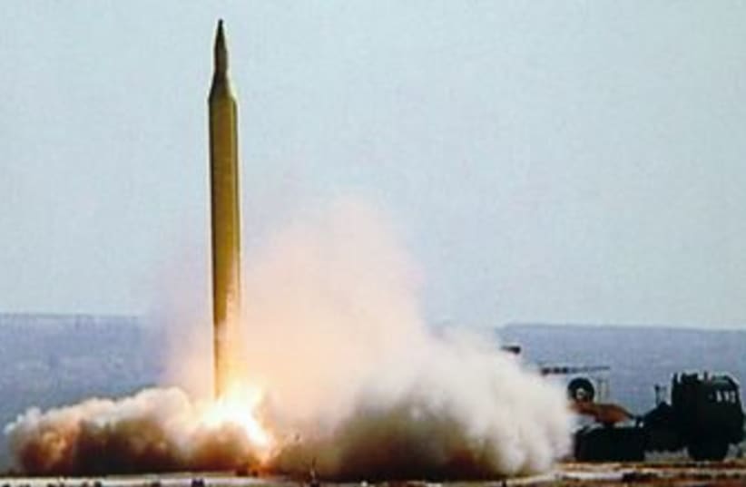Iran test fires a Fajr-3 missile 370 (R) (photo credit: IRNA / Reuters)
