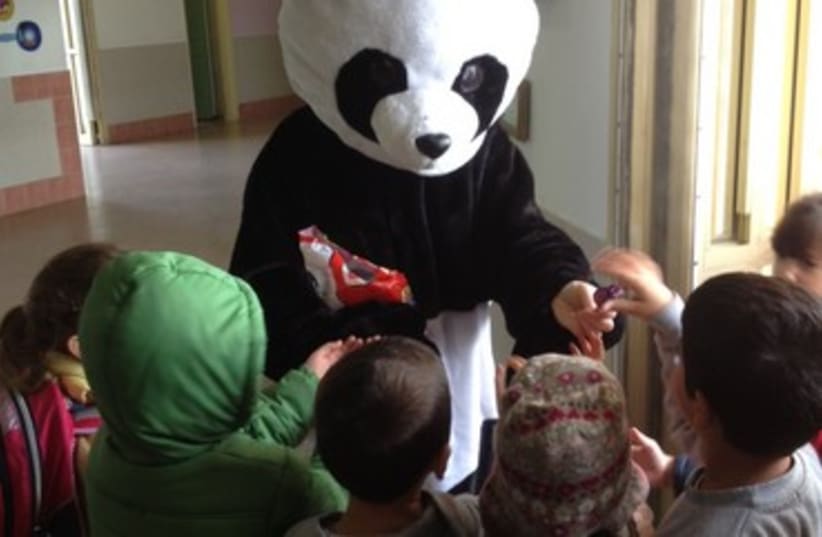 Children at Nitzan scool greeted by a Panda bear 370 (photo credit: Isabelle Sharon)
