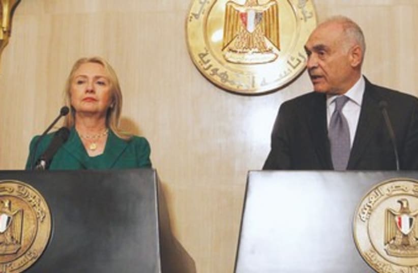 US Secretary of State Clinton with Kamel Amr 370 Amr  (photo credit: REUTERS)