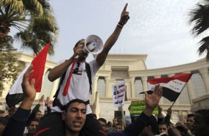Morsi supporters outside Constitutional Court in Egypt 370 R (photo credit: Amr Dalsh / Reuters)