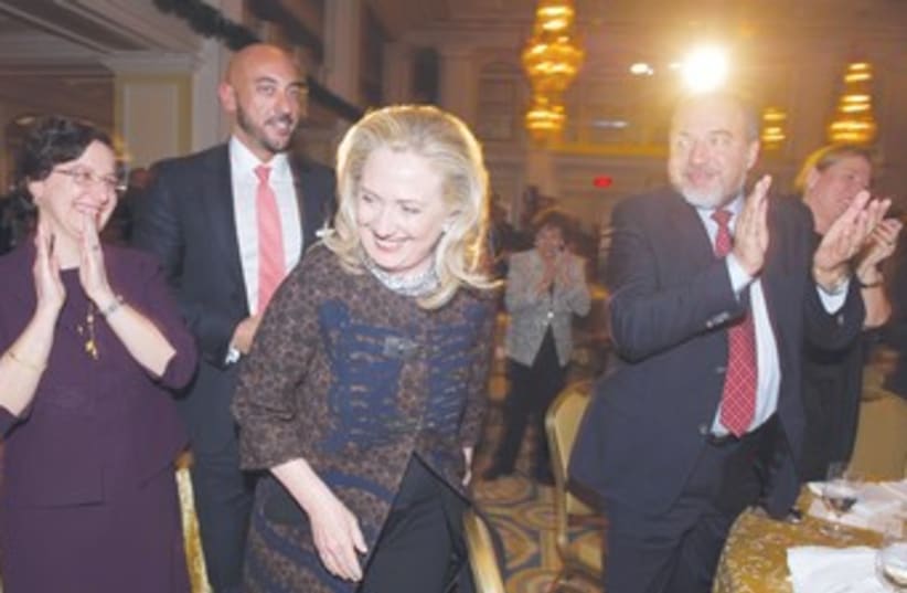 Clinton (middle), Liberman (right) 370 (photo credit: Mary F. Calvert/Reuters)