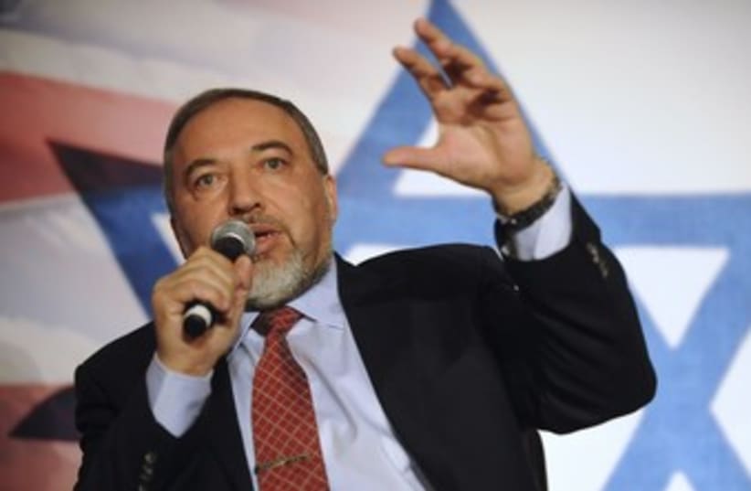 Liberman in front of star of david 370 (photo credit: REUTERS/Mary Calvert)