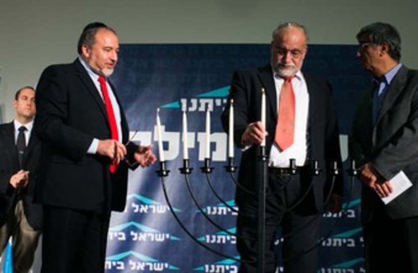 Liberman lights candles with Rotem and Ohayon 370 (photo credit: Courtesy)