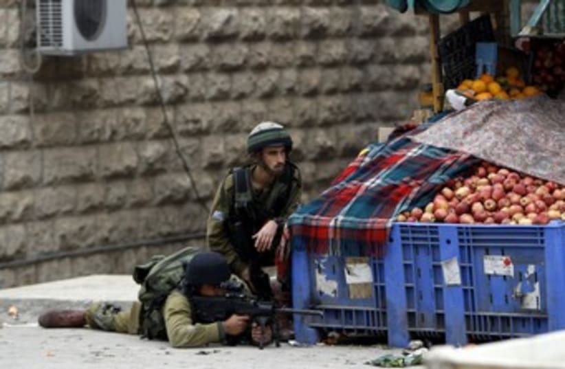 IDF soldiers in Hebron 370 (photo credit: REUTERS/Ammar Awad)