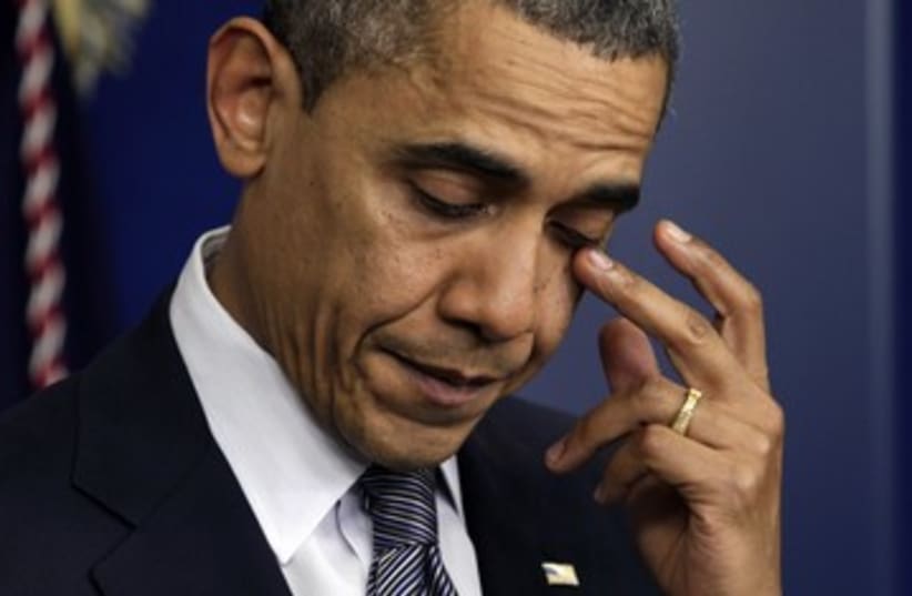 Tearful US President Barack Obama after shooting 390 (photo credit: Yuri Gripas / Reuters)