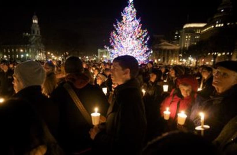 Mourners for school shooting victims in Connecticut 370 (R) (photo credit: REUTERS/Michelle McLoughlin)
