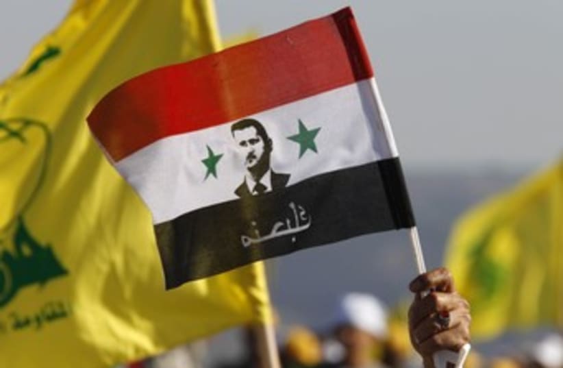 Flags of Hezbollah, Assad's Syria 370 (photo credit: REUTERS/Ali Hashisho)