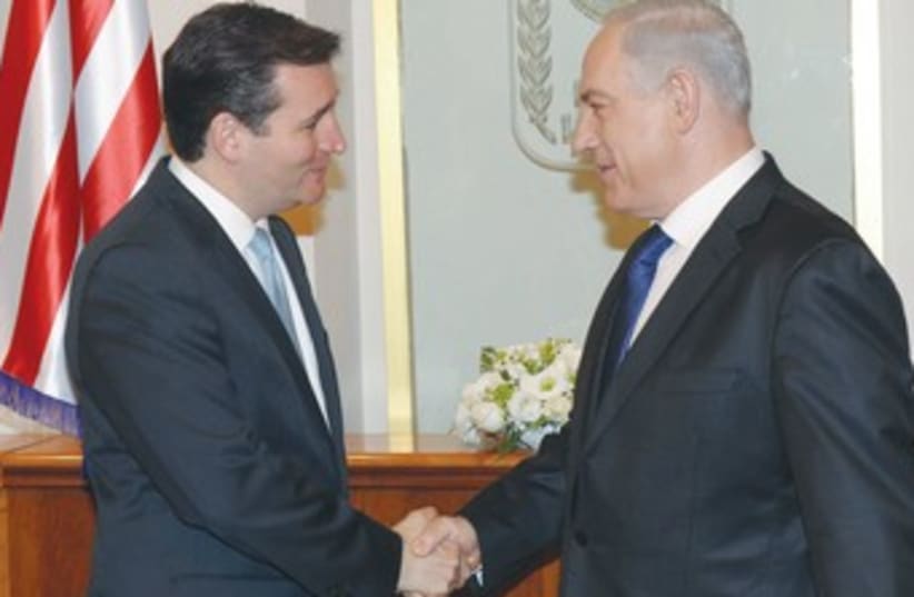 PM shakes hands with Republican senator-elect Ted Cruz 370 (photo credit: Amos Ben-Gershom/GPO)