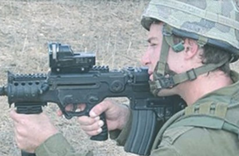 IDF soldier shooting Tavor rifle 370 (photo credit: IDF Spokesman)