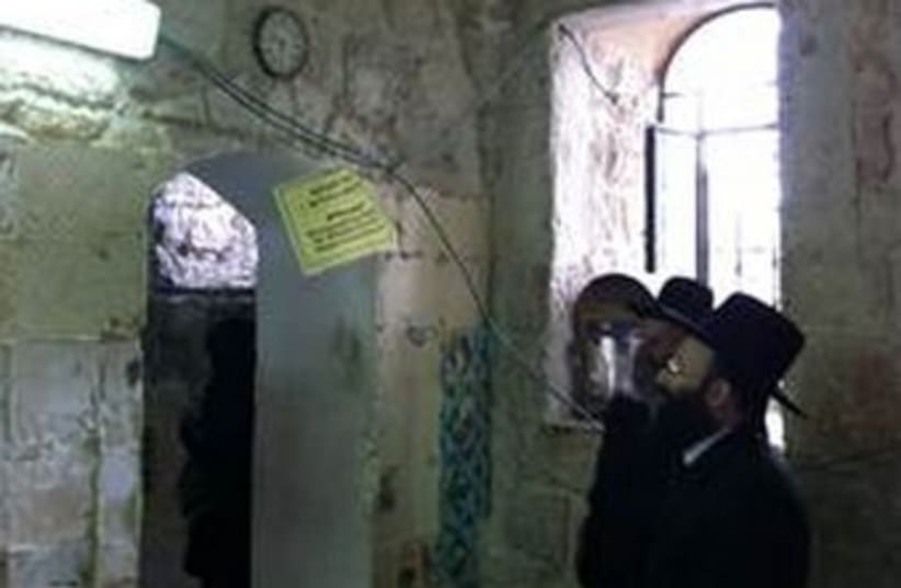  Rabbi of Western Wall, Rabbi Rabinowitz, observe vandalism  (photo credit: Courtesy of Western Wall Heritage Fund)