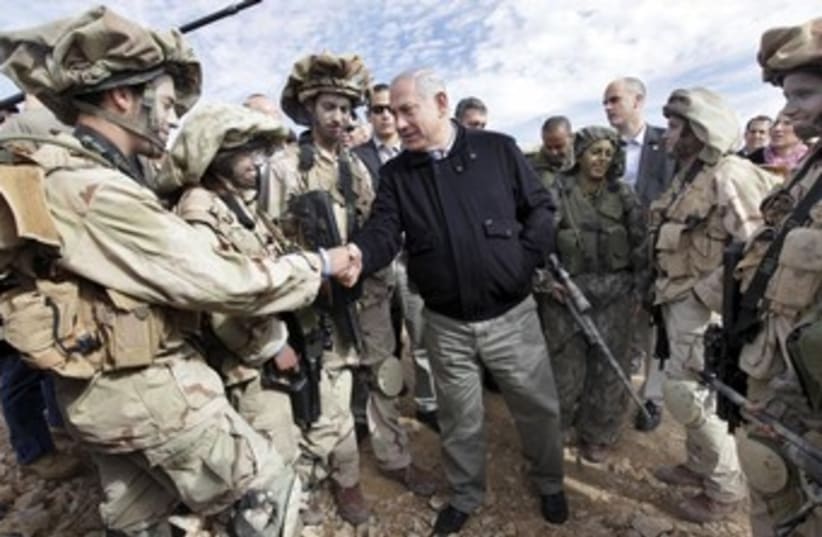 Netanyahu shakes hands with IDF soldiers 370 (photo credit: REUTERS/POOL New)