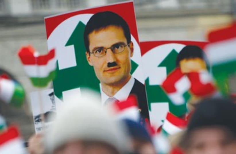 Defaced placard of Jobbik Party leader Gyongyosi 370 (photo credit: REUTERS)