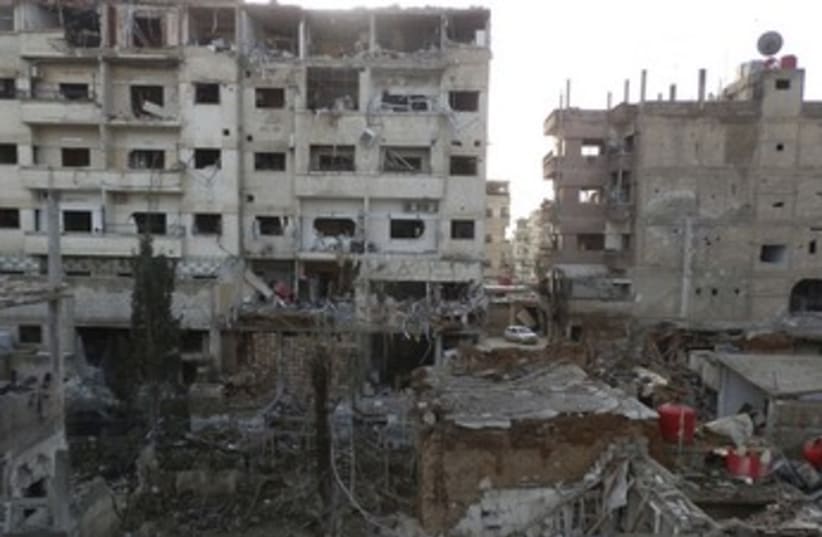 Damaged buildings in Daraya near Damascus 370 (photo credit: reuters)