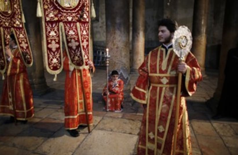 Members of the Greek Orthodox clergy and altar servers 370 (photo credit: Reuters/Ammar Awad)