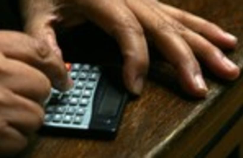 An accountant calculator taxes 150 (photo credit: Ivan Alvarado / Reuters)