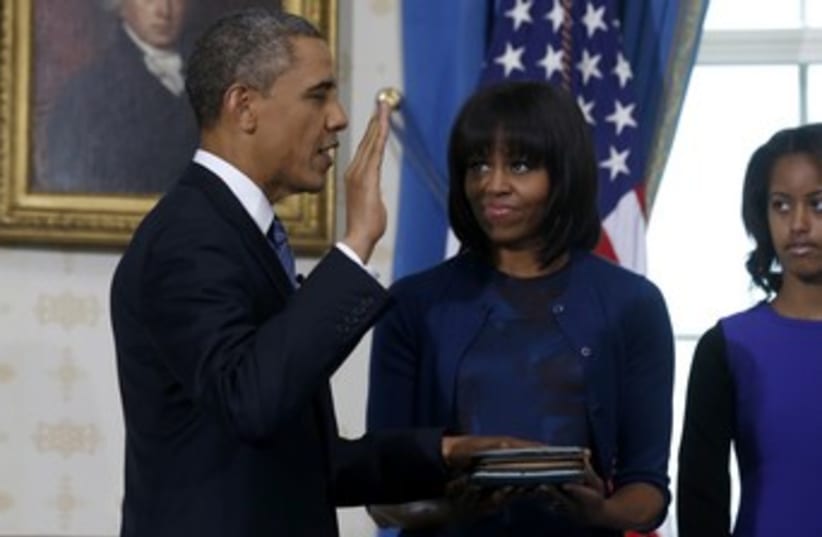 US President Barack Obama being sworn in to 2nd term 370 (photo credit: REUTERS/Larry Downing)
