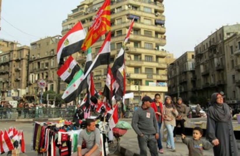 A vendor sells flags in Tahrir Square 370 (photo credit: MELANIE LIDMAN)