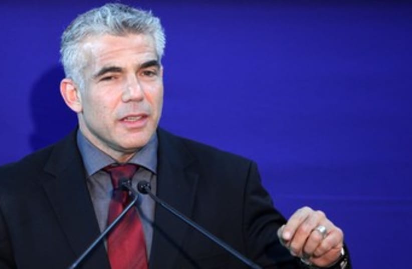 Yair Lapid at the President's residence 370 (photo credit: Marc Israel Sellem/The Jerusalem Post)