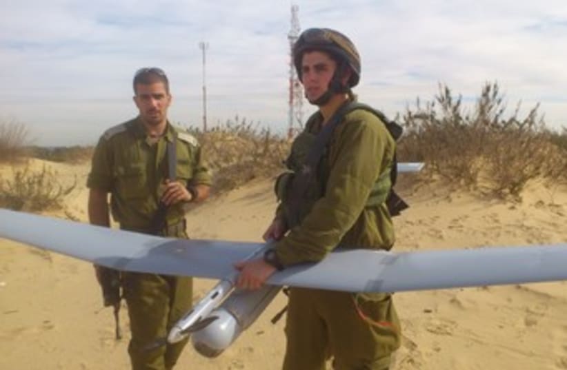 SEC.-LT. ITZIK COHEN holds a Sky Rider drone before takeoff  (photo credit: YAAKOV LAPPIN)
