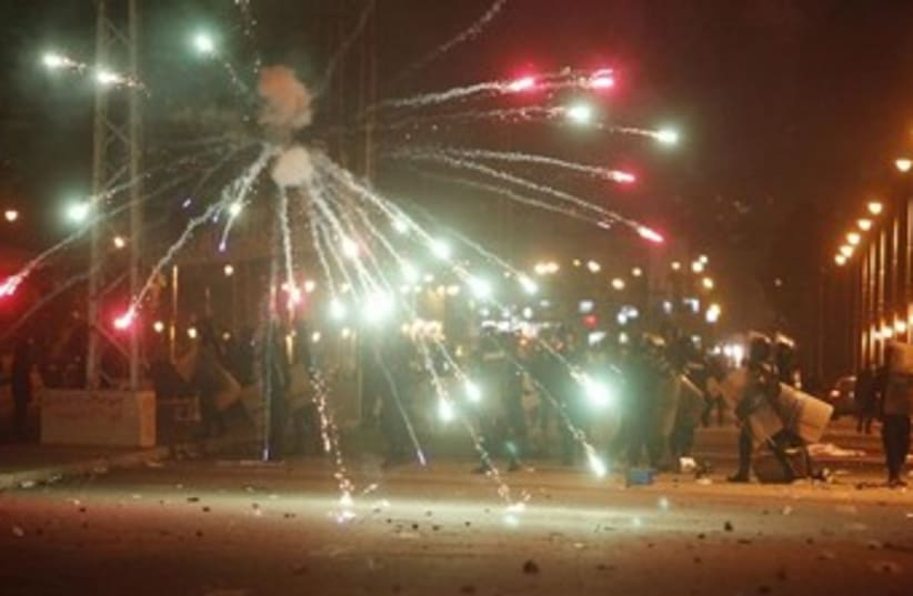 Egyptian protesters throw fireworks at police 370 (photo credit: REUTERS/Asmaa Waguih)