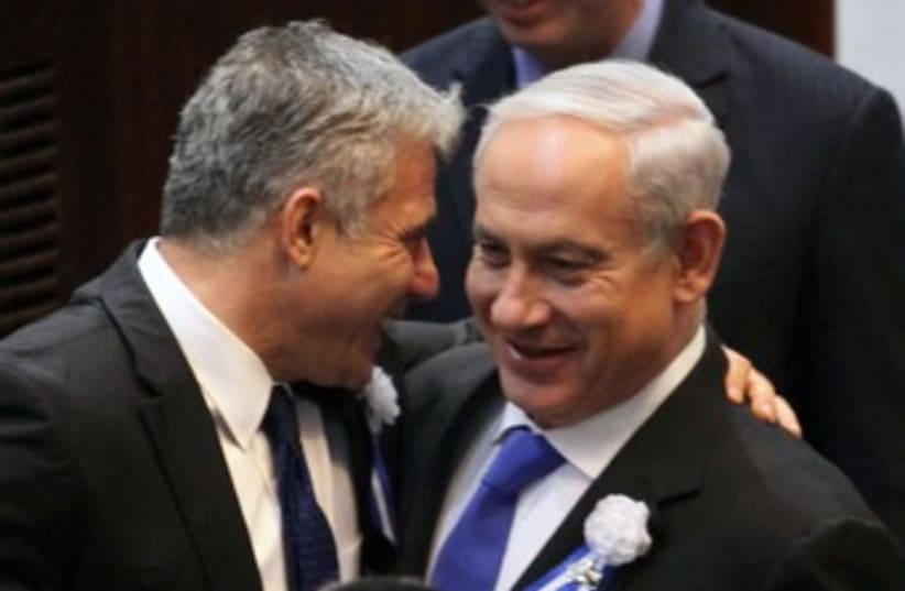Lapid Netanyahu at Knesset swear in 370 (photo credit: Marc Israel Sellem/The Jerusalem Post)