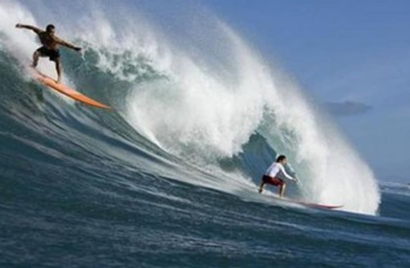 Hawaii surfers (photo credit: Reuters)