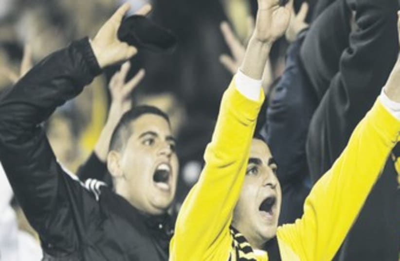 Fans shout at Betar Jerusalem match 370 (photo credit: REUTERS)