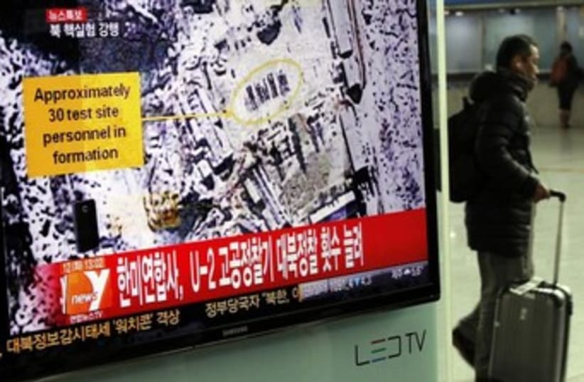 report on North Korea's nuclear test (photo credit: REUTERS/Kim Hong-Ji)