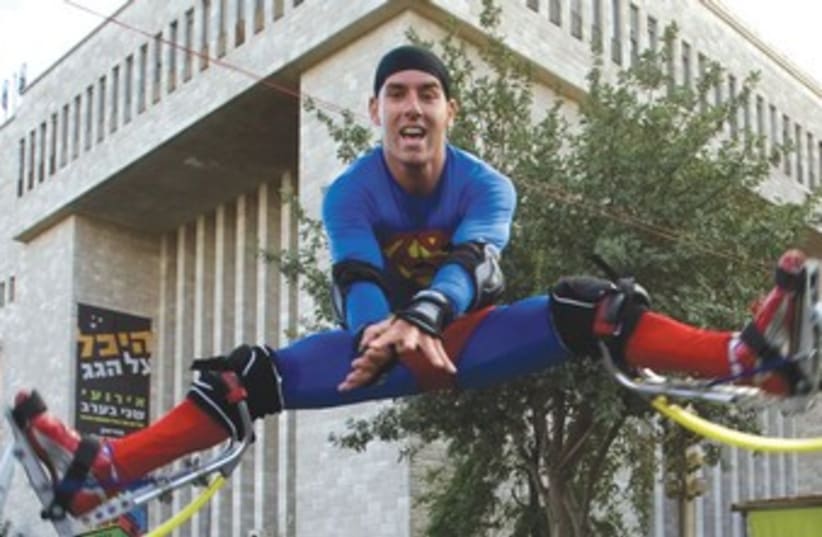 MAN dressed as Superman 370 (photo credit: Reuters)