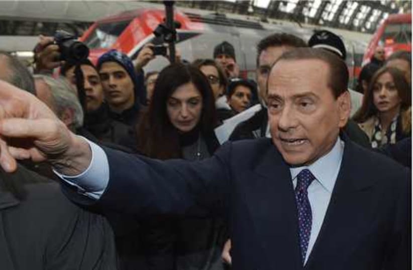Former Italian prime minister Silvio Berlusconi 521 (photo credit: LORIS SAVINO / REUTERS)