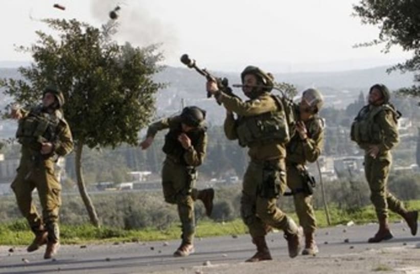 IDF disperses Palestinian riot 370 (photo credit: REUTERS)